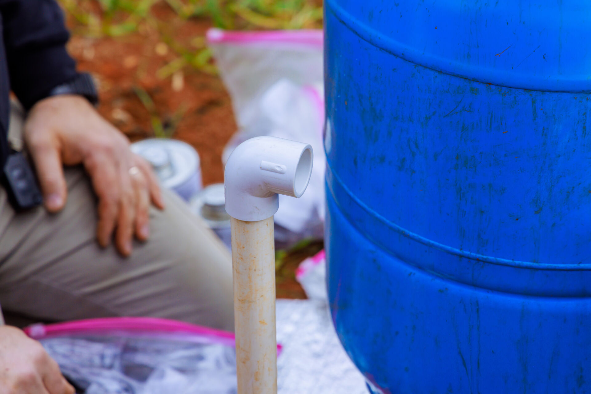 After water bore hole drilling, an underground pipeline is connected to well pump for new residence by plumber
