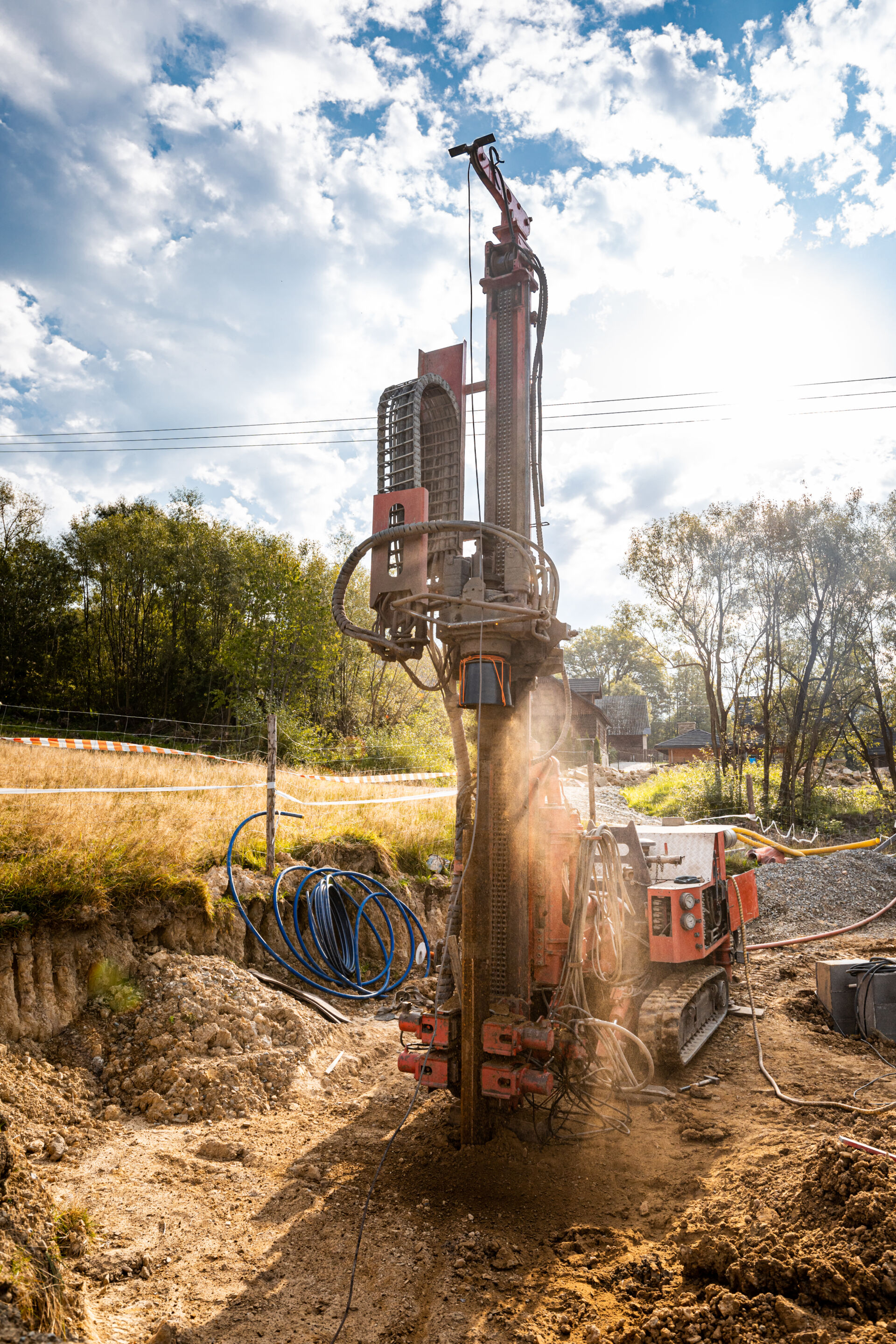 Drilling water bore hole wells in the ground using a professional drill and machine