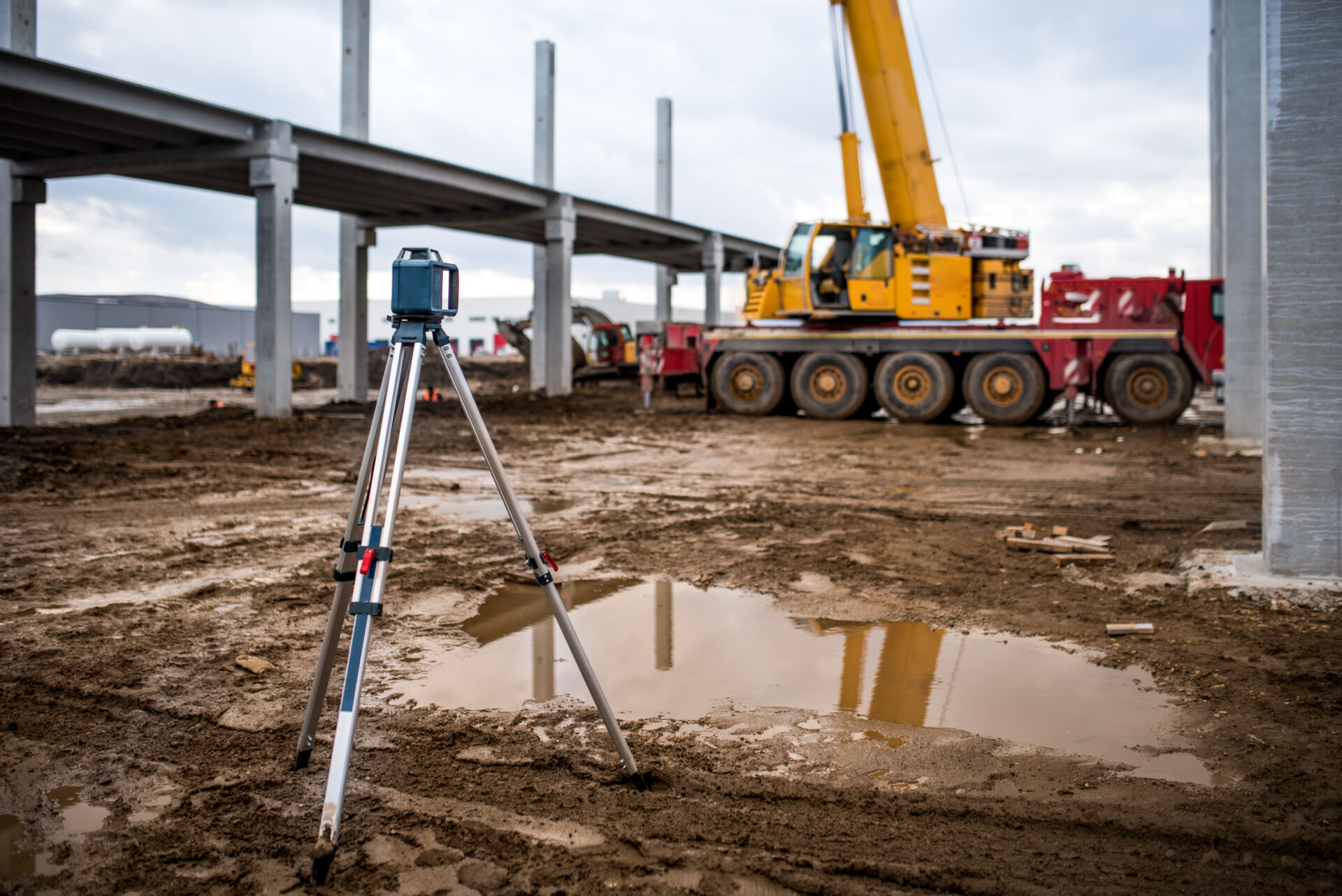 Industrial engineering land survey at construction site outdoors during site and ground investigations
