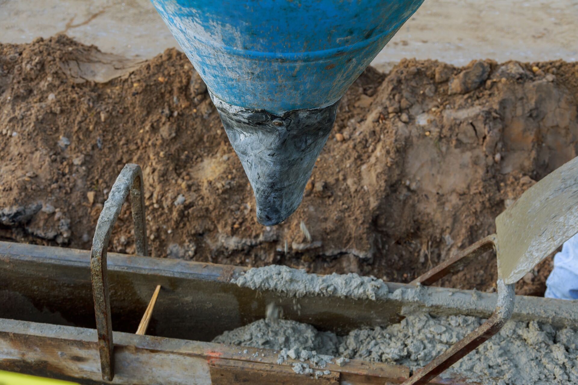 Commercial service of pouring concrete from concrete truck after drilling water bore hole